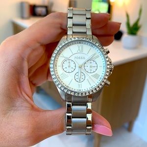 Silver Fossil watch.